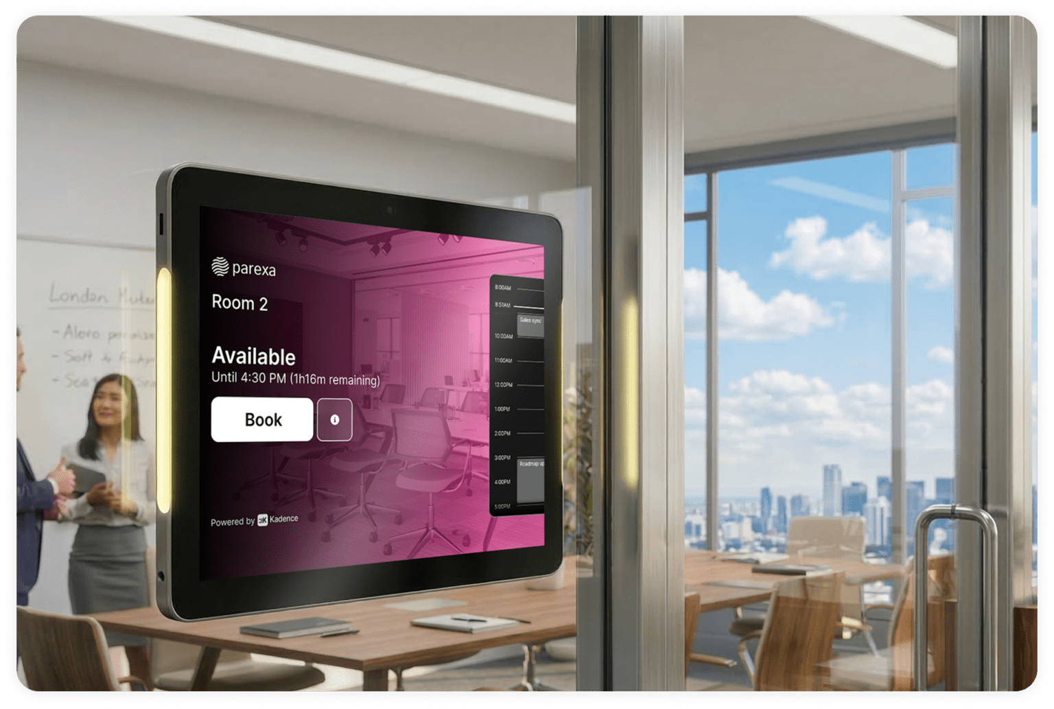 Kadence Room Display tablet mounted outside a meeting room showing live availability, time remaining, and a one-tap Book button, powered by Kadence.